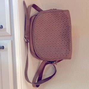 Tan, leather Isaac Mizrahi saddle bag w/tassel